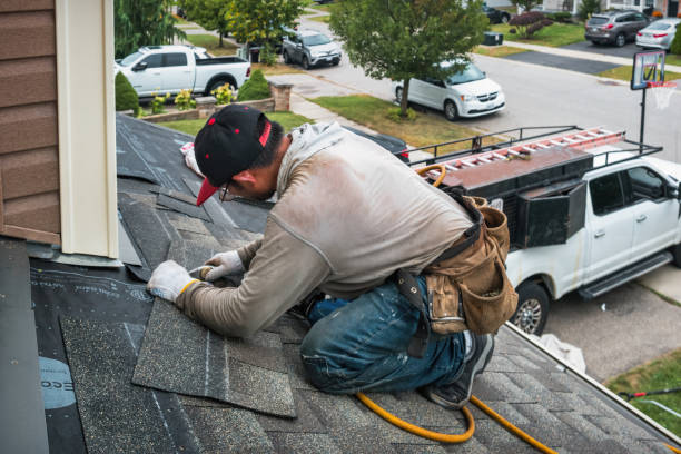 Professional Roofing technician working in Preston, IA
